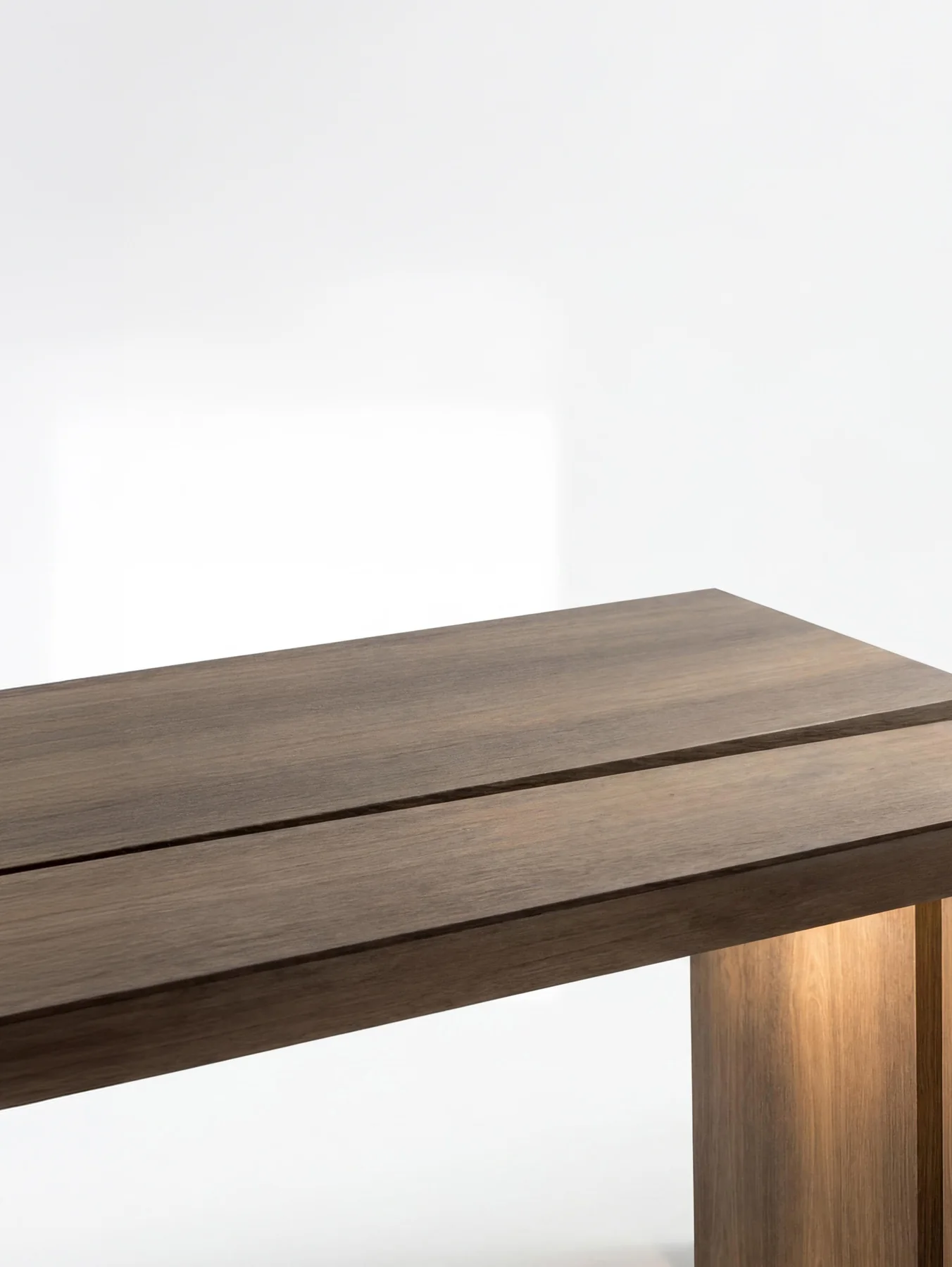 Minimal dark wood table showing refined grain